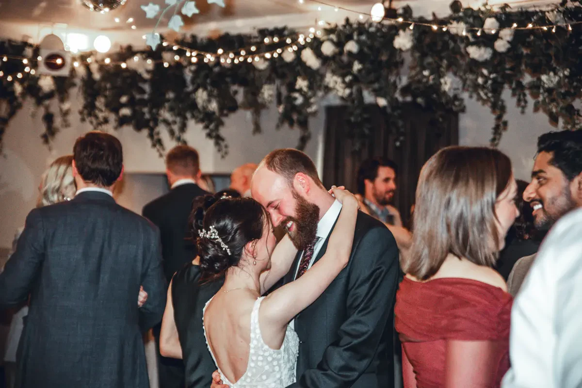 Close up of a happy wedding couple on the dance floor during an alternative Melbourne DJ hire set at Poets Lane reception