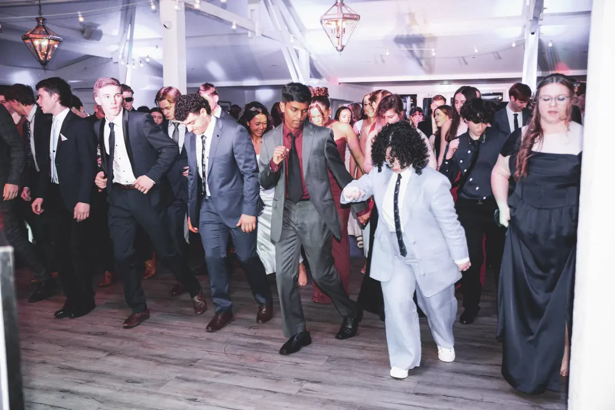 High energy crowd singing along on the crowded dance floor with a professional wedding DJ Melbourne at Bramleigh Estate