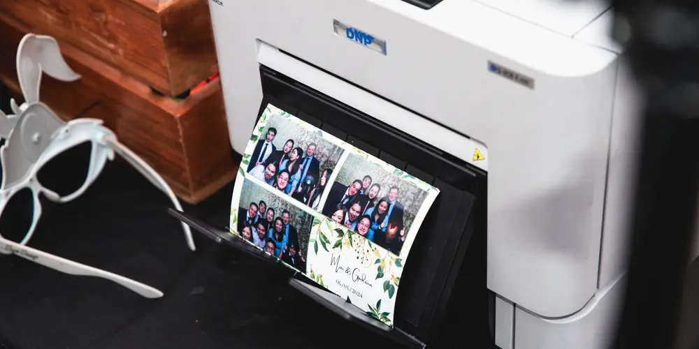 Instant high-quality photo printout with custom floral border from a professional DNP photo booth printer