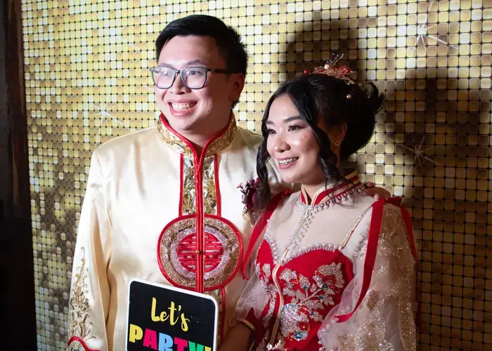 Close up of happy couple posing in the photo booth at Olinda Tea House wedding with Matt Jefferies Entertainment